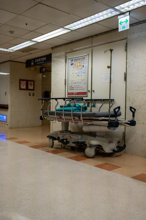 Beds in hospital waiting area. Empty hospital bed after patient leaves after recoveryの写真素材