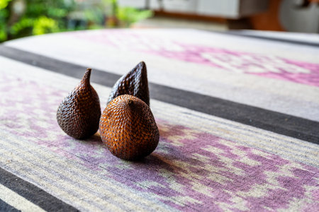 Salak fruit (Snake fruit, Salacca zalacca) on bright dining tableの写真素材