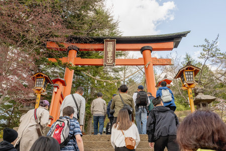 Fujiyoshida, Yamanashi, Japan - APR 17 , 2024: Mount Fuji with cherry blossoms in Arakurayama Sengen Park.の写真素材