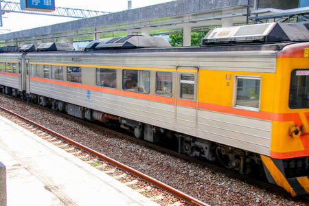 Taiwan May 21, 2024: A scenic view of a train at Fuli Station in Hualien, Taiwan, with clear sky and mountain background. Ideal for travel, transport, and rural tourism themes. Fuli Station and Train in Taiwanの写真素材