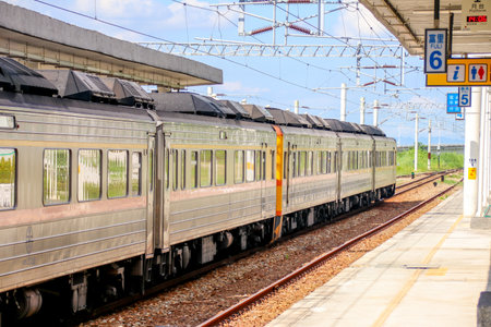 Taiwan May 21, 2024: A scenic view of a train at Fuli Station in Hualien, Taiwan, with clear sky and mountain background. Ideal for travel, transport, and rural tourism themes. Fuli Station and Train in Taiwanの写真素材