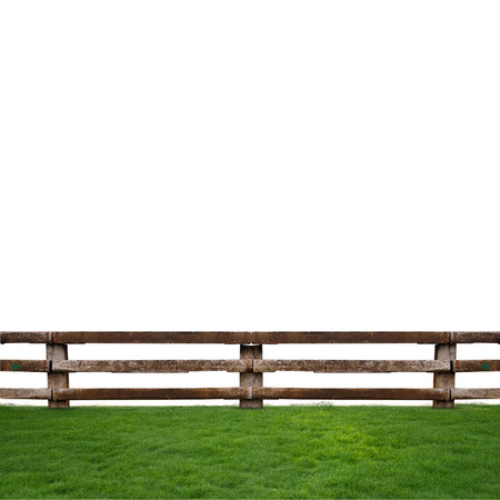 wooden fence on grassの写真素材