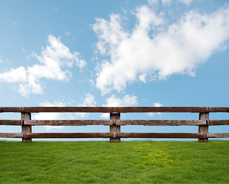 wooden fence on grassの写真素材