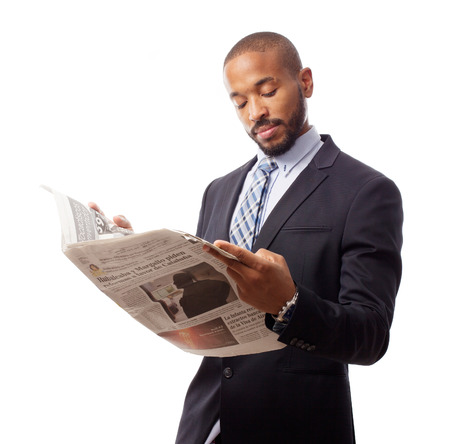 young cool black man reading newsの写真素材