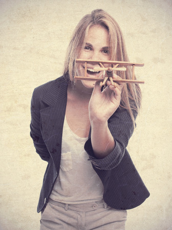 young cool woman with a wooden planeの写真素材