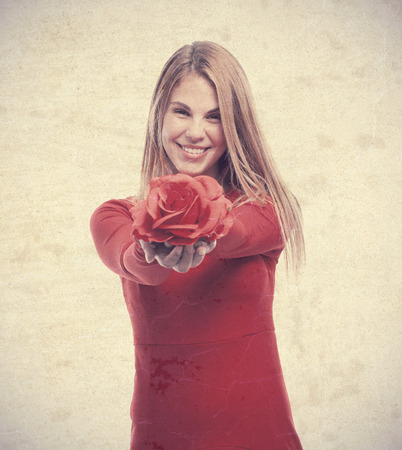 young cool woman with a roseの写真素材