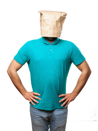 proud man with a paper bag in his headの写真素材