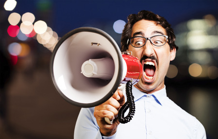 young cool man with a megaphoneの写真素材