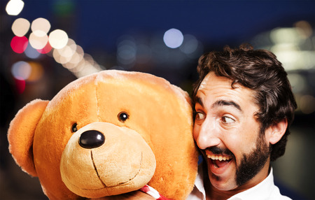 young cool man with a tedy bearの写真素材