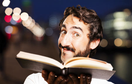 young cool man with a bookの写真素材