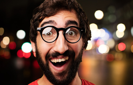 young crazy man surprised expressionの写真素材