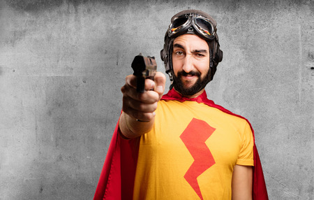 crazy super hero with a gunの写真素材