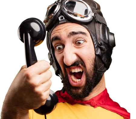 crazy super hero with mobile phoneの写真素材