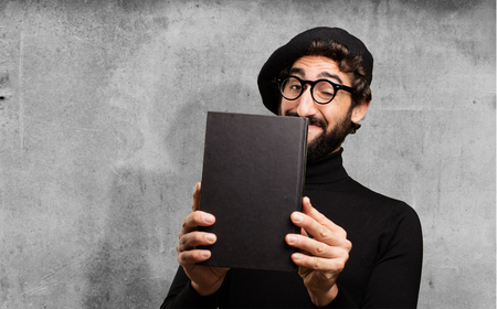 young french artist with a bookの写真素材