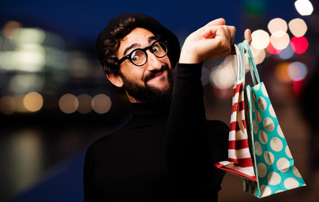 young french artist with shopping bagsの写真素材