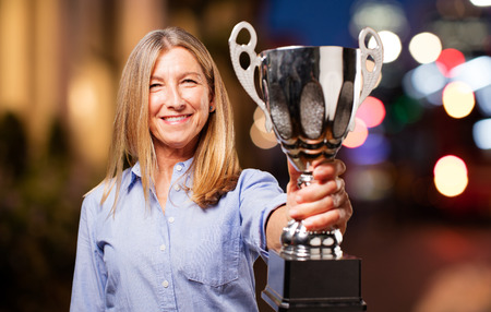 senior beautiful woman with sport cupの写真素材