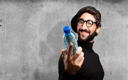 young french artist with water bottleの写真素材
