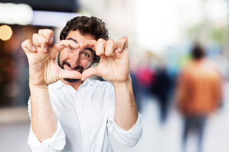 young funny man heart signの写真素材