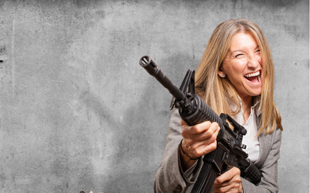 senior beautiful woman with a rifle