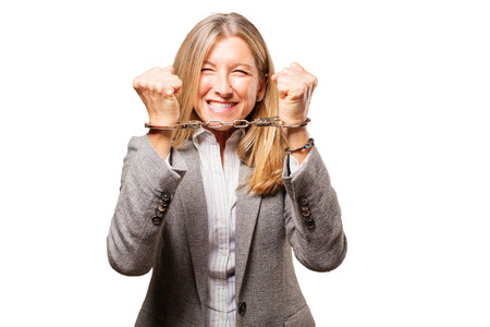 senior beautiful woman with handcuffsの写真素材