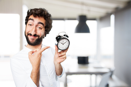 young funny man with clockの写真素材