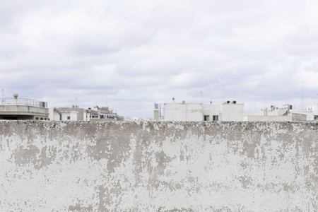 damaged cement wall background and clowdy skyの写真素材