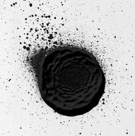 black ink shape on watercolor paper textureの写真素材