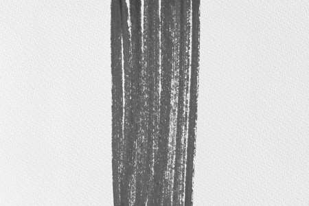 black ink shape on watercolor paper textureの写真素材