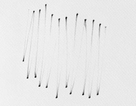 black ink shape on watercolor paper textureの写真素材