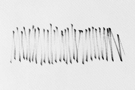 black ink shape on watercolor paper texture