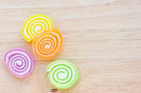 Colorful jelly on wooden boardの写真素材