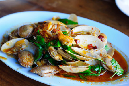 Stir fried clams with chili paste and basil leafsの写真素材