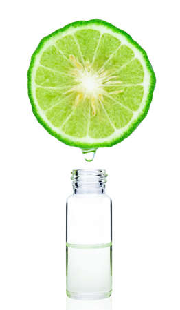 Bergamot fruit with bottle extract oil on white background.  Sour food fruit. Herb for use a cosmetic product in beauty treatment.の写真素材