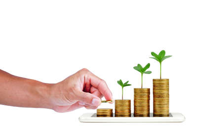 Money saving. smart phone with a tree growing on a coin step increase on white background. business growth and success concept.の写真素材