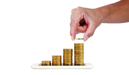Money saving with hand holding a coin money on a coin step increase on smart phone. Business growth...