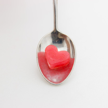 Candle in glass isolate on white backgroundの写真素材