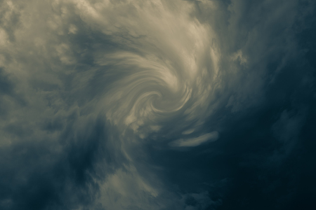 spining dark storm clouds before rainの写真素材