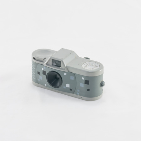 Camera retro miniature on white background isolated.