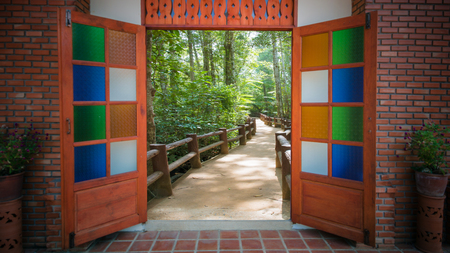Garden gate out into the corridor in the wild.の写真素材