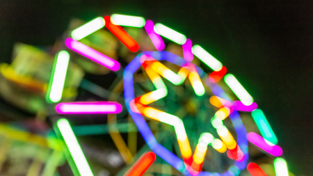Very blurred Ferris wheel at night.の写真素材