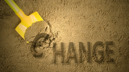 Change concept by digging sandの写真素材