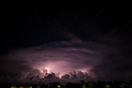 formation of lightning clouds at nightの写真素材