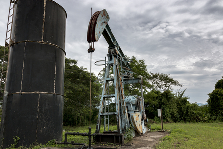 The oil pump in a rice field in the countryside.の写真素材