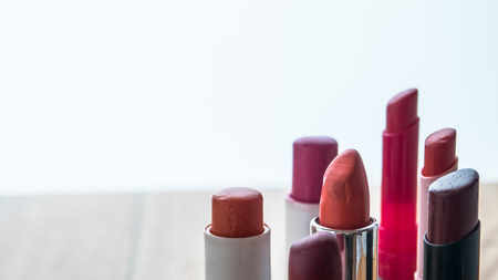 Many lipsticks on white background.の写真素材