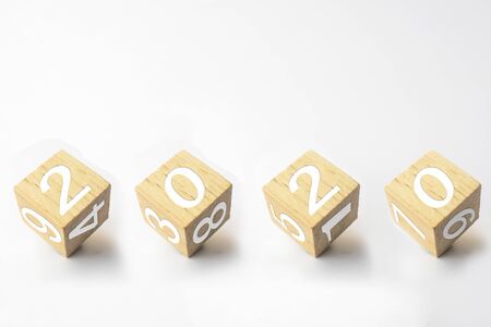concept wood cube calendar 2020 on white background.