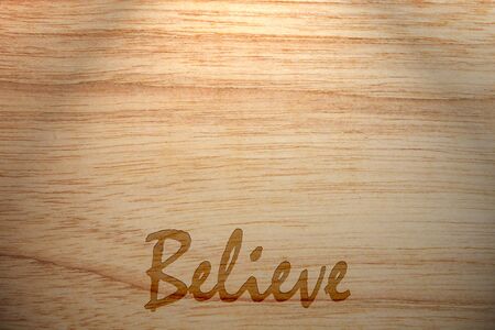 concept closeup text believe on wood.の写真素材