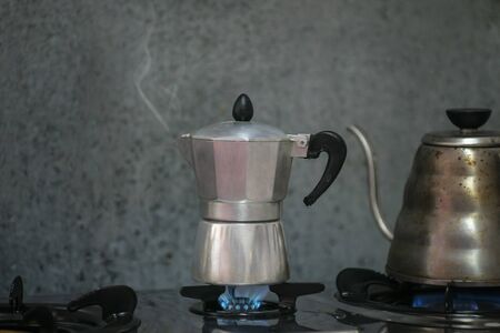 Mocha pot coffee is made in the kitchen at home.の写真素材