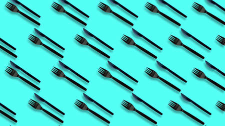 Black Plastic forks and cutlery on pastel colors