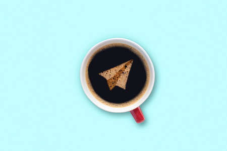 Coffee cup with latte art foam paper plane Top view