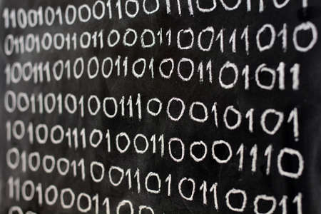 The numbers zero and one, written on a blackboard, binary systemの写真素材
